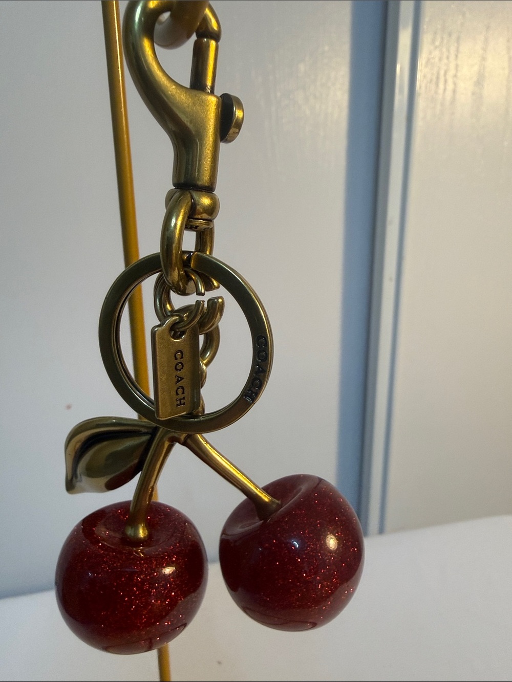 Coach Antique Gold Cherry Charm with Glittering Red Cherries